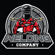 © bazzier - welder wearing welding helmet pose in badge
