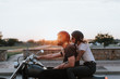 © Rawpixel.com - Biker couple riding down the road in the sunset