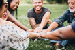 © Rawpixel.com - Happy people stacking hands together in the park