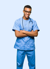 Wall Mural - Surgeon doctor man with glasses and smiling on isolated background