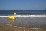 Fototapeta Tęcza - buoys and coast