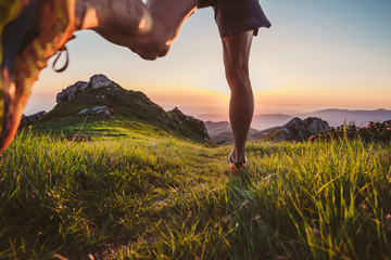Wall Mural - man trail running on a mountain at the dask