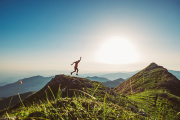 Wall Mural - man trail running on a mountain at the dask
