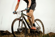 Extreme Cross-country Cycling Athlete Mountain Biker Riding On Trail