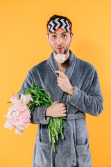 bouquet of tulips in hand on white background close-up. Concept 8 March, international women's day. Valentine's Day. Smart young man at Valentine's day. Concepts. Love - Image