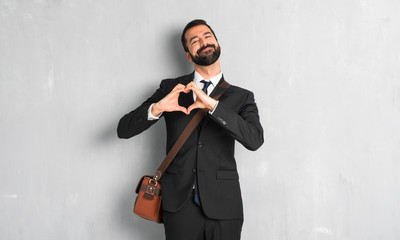 Businessman with beard making heart symbol by hands