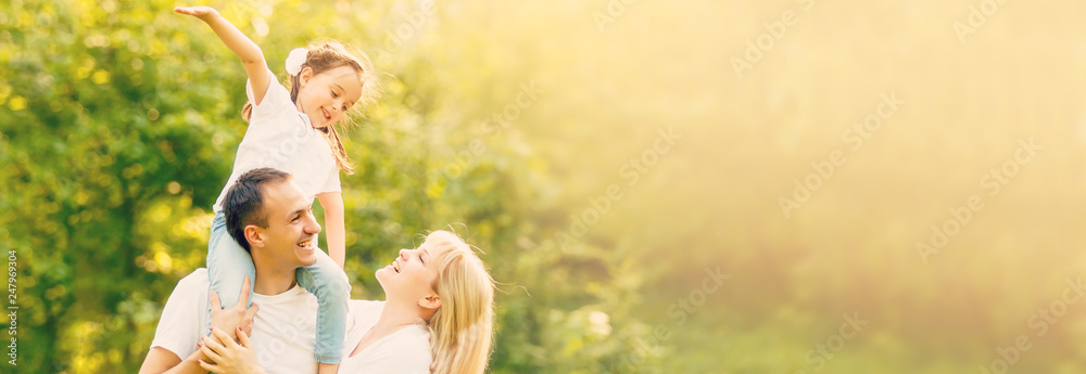 Happy family: mother father and child daughter on nature on sunset - obrazy, fototapety, plakaty 