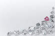 Variously cut diamonds scattered along the image corner on white background