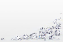 Variously Cut Diamonds Scattered Along The Image Corner On White Background