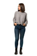 © luismolinero - A full-length shot of a Young woman looking to the side over isolated white background