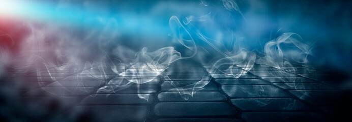 Dark empty room with rays of light, searchlight. Concrete floor, smoke. Color correction