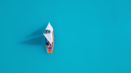 Wall Mural - yacht on the water surface from top view. turquoise water background from top view. summer seascape 