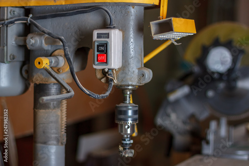 The Power Buttons Of The Drilling Bench Press In The Carpenter