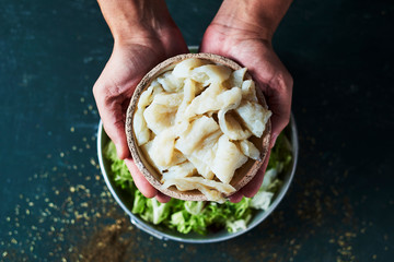 Wall Mural - man preparing xato, catalan salad with raw cod