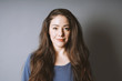 © Axel Bueckert - happy young woman in her 20s with natural make-up and brunette long hair smiling