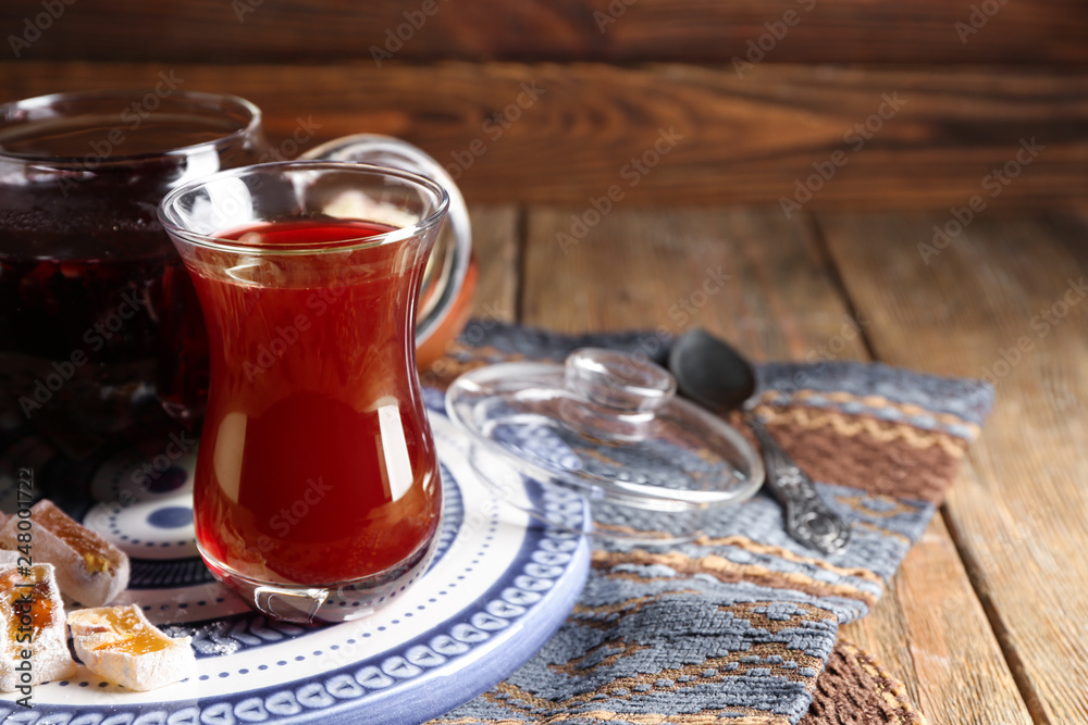 Glass of tasty Turkish tea on table