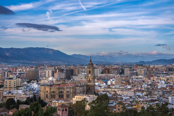 Wall Mural - Beautiful sunrise sky in the marina bay of Malaga city. Stunning pink and orange seascape.