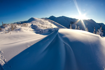 Beautiful wind textured snow in cold, windy winter mountain conditions in Siberia.