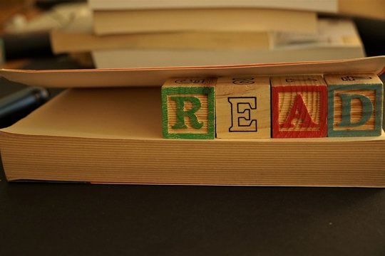 Wooden cubes forming the word Read