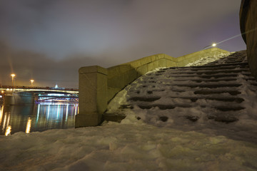 Wall Mural - Snow covered icy staircase in night winter Moscow