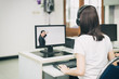 © Prasit Rodphan - Asian woman student video conference e-learning with teacher on computer in IT room at university. E-learning ,online ,education concept.
