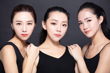 Wall Mural - Three asian young beauty with black background