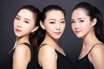 Wall Mural - Three asian young beauty with black background