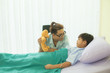 © emodpk - One father smiled and offered a teddy bear to a seriously ill son. To encourage the fight against illness In a hospital - Healthcare concept image