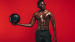 © Jacob Lund - African american man exercising with a fitness ball