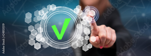 Cuadros en Lienzo Woman touching a validation process concept