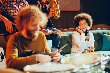 Sticker - Multicultural jazz band practicing for the gig in home studio.