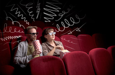 Wall Mural - Young cute couple sitting in cinema, and eating popcorn while watching movie with doodle graphics