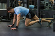 © paul prescott - Muscular man practicing climbers exercise at the gym.