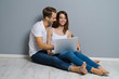 © vgstudio - Beautiful young couple using laptop
