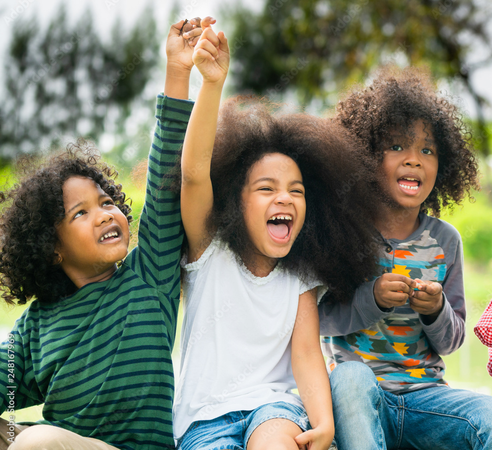 Happy African American boy and girl kids group playing in the playground in  school. Children friendship and education concept. Stock Photo | Adobe Stock, image size:1000x916