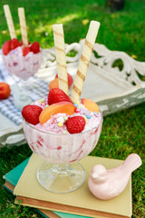 Sticker - Ice cream dessert with fresh strawberries, peaches and crispy wafer rolls.