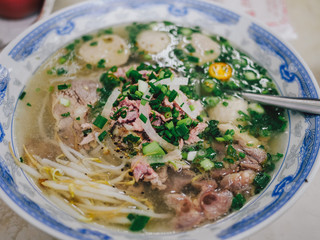 Traditional Vietnamese soup Pho Bo | Bowl of pho noodle with meat, beef,  scallions in Saigon, Vietnam