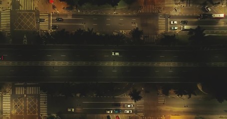 Wall Mural - Aerial image of the center of a city at night, cars passing over viaduct