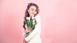 © puhimec - Young girl with tulips on a colored background