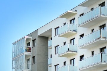 Modern apartment buildings on a sunny day with a blue sky. Facade of a modern apartment building