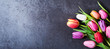 Leinwandbild Motiv Tulips bouquet on dark grey background