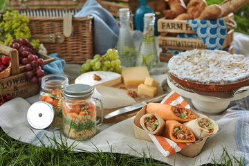 Picnic fare on a blanket on the grass