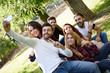 © javiindy - Group of friends taking selfie in urban background