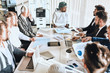 © alfa27 - arabic boss is sharing with his knowledge with colleagues. formal meeting . deligation from Arabic countries