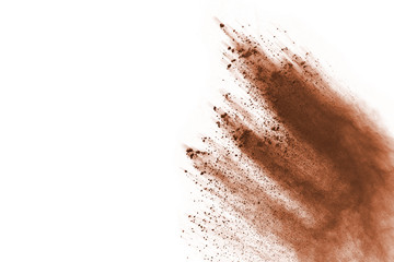 Wall Mural - brown color powder explosion on white background. colored cloud. colorful dust explode. paint holi.