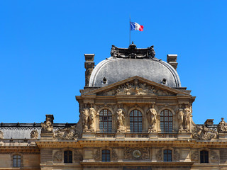 Wall Mural - France flag on the roof of the Palais du Louvre. Sunlight day