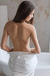 © alfa27 - Concept of relaxation and healthy spa. Back view of perfect shaped figure of young woman getting readyfor body massage after warming bath.