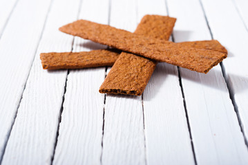 Poster - dog biscuits on white wood background