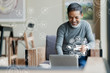 © ChayTee - Asian or Hispanic man using Laptop and credit card payment shopping online with icon customer network connection on screen and connecting with omni channel system. Older man satisfied with CRM system