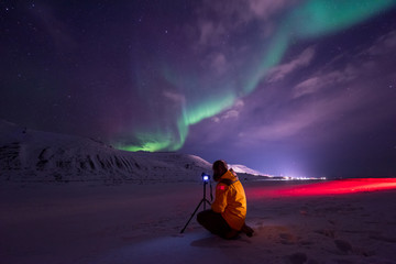 Wall Mural - the polar arctic northern lights aurora borealis sky star in norway travel svalbard in longyearbyen 
